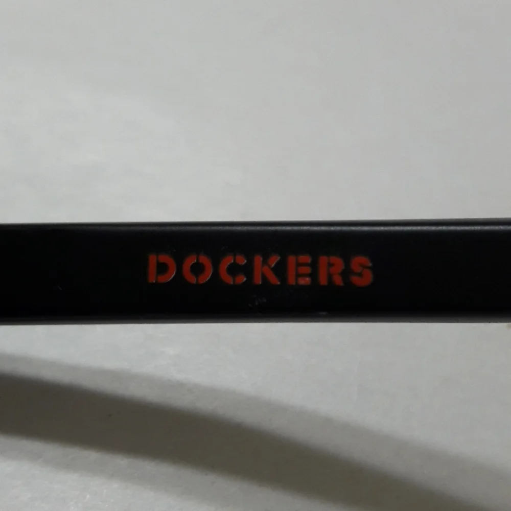 Dockers Unisex Sunglasses Blue Lens Black Frame UVA-UVA Protection Unise…